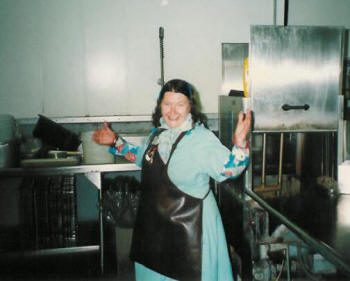 Rosemary Johnson church member and longtime volunteer joyfully washes dishes during lunchtime.