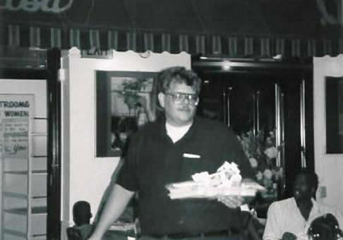 Here Jonathan clears tables in the church dining room that was designed to serve people in a nice cafe.