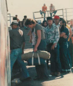 People enter the Hobo Bus for the evening meal.